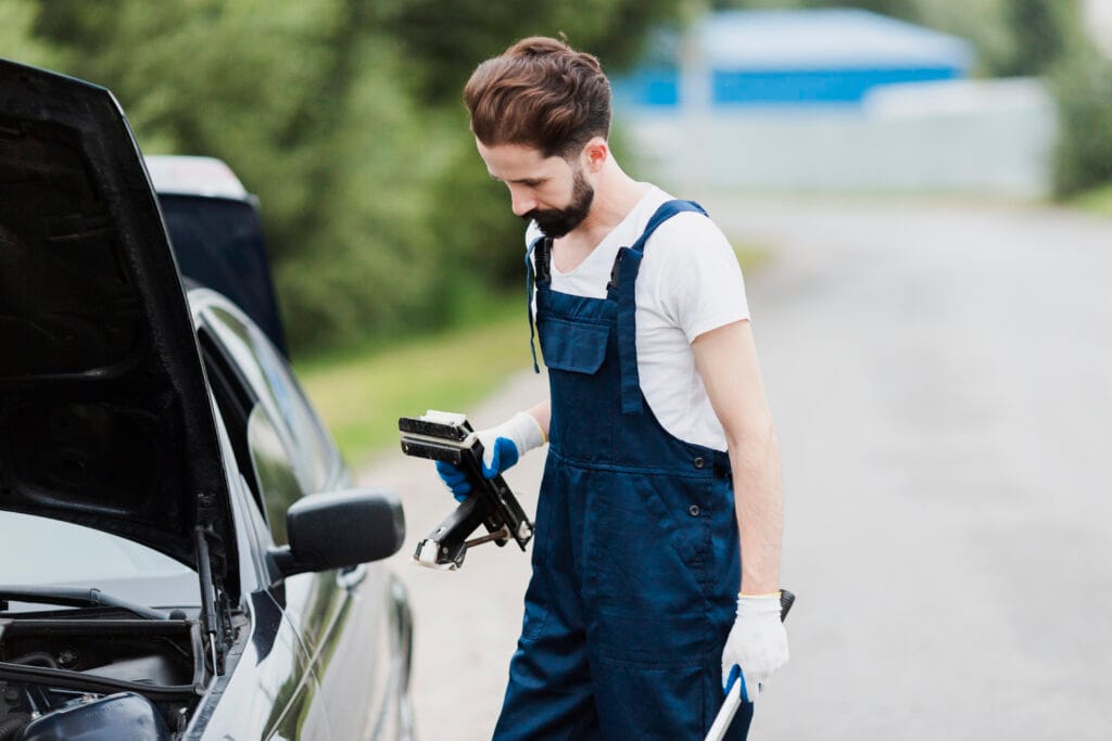 side view man overalls with wrench